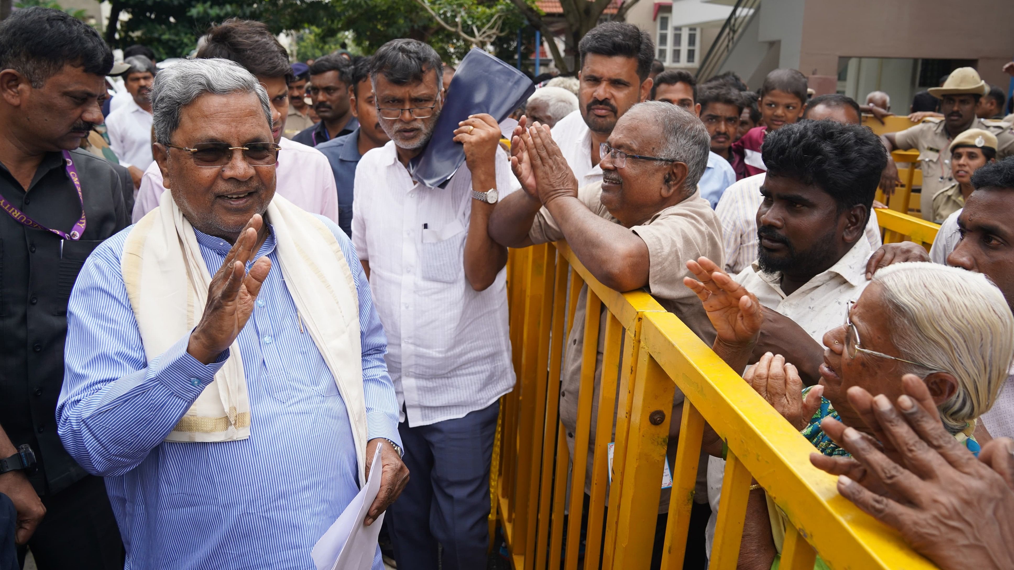 <div class="paragraphs"><p>Chief Minister Siddaramaiah interacts with people, near his residence, in Mysuru.</p></div>